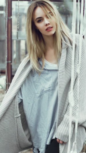 Blonde girl in a sweater
