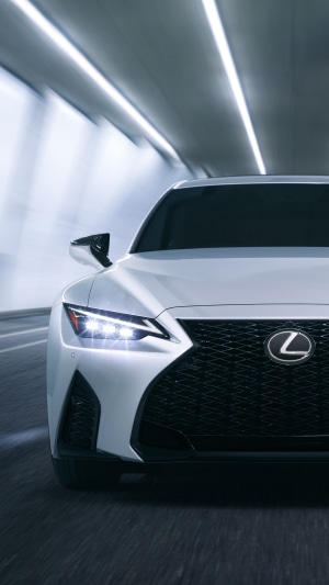White Lexus IS driving through a tunnel