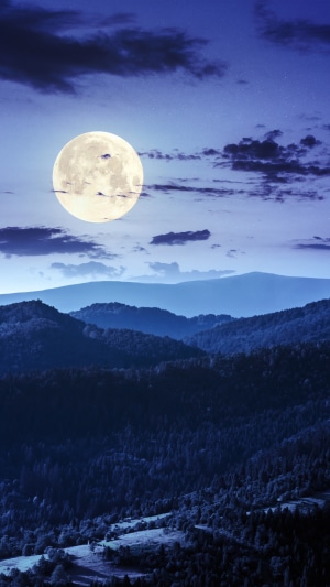 Full Moon Over Mountain Landscape at Night