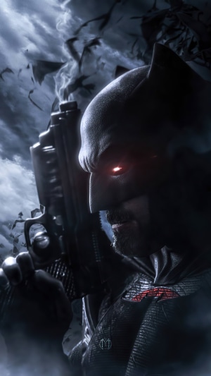Batman holding a gun with red glowing eyes