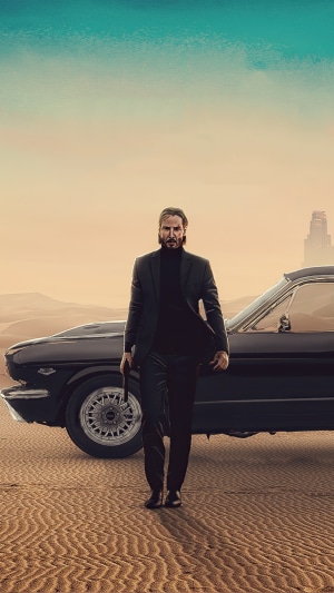 John Wick with a car in the desert