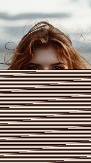 Redhead girl looking at the camera