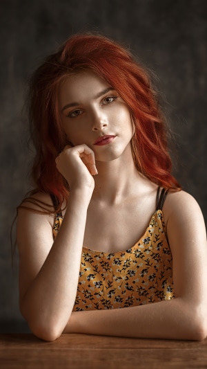 Redhead girl in yellow floral top