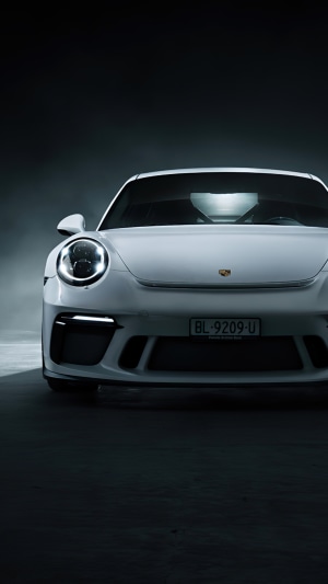 White Porsche 911 GT3 R on a dark background