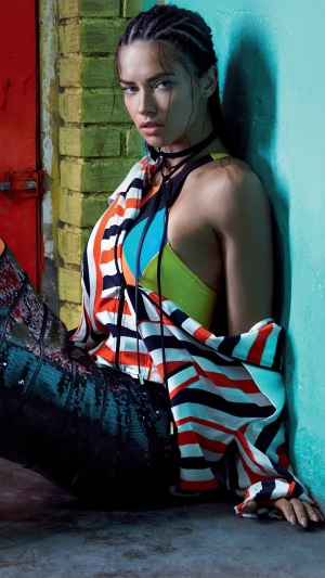 Adriana Lima posing in colorful outfit