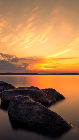 Rocks in the water at sunset