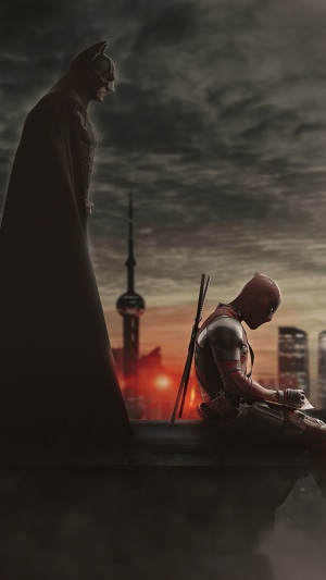 Batman and Deadpool on a rooftop