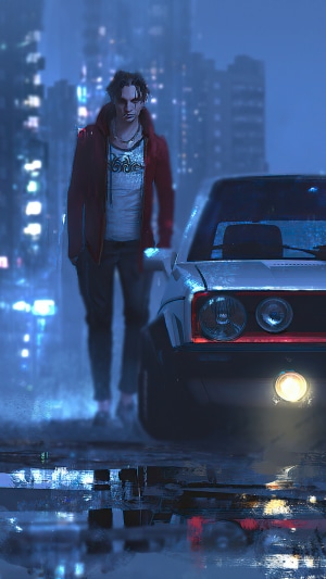 Man standing next to a car in a city at night