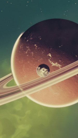 No Man's Sky planet with rings and moon