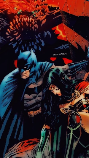 Batman and Wonder Woman with a monster