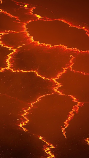 Molten lava lake with glowing cracks