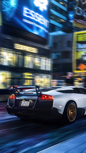 White Lamborghini Murcielago LP 670 driving at night