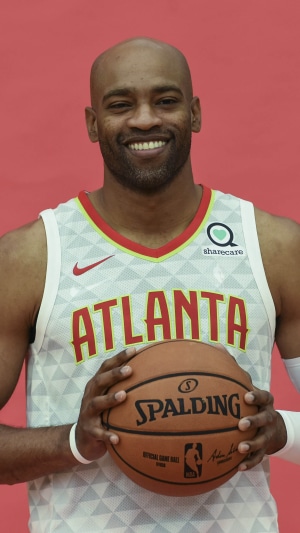 Vince Carter of the Atlanta Hawks holding a Spalding basketball