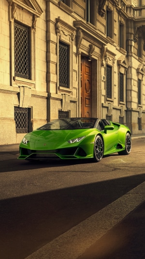 Green Lamborghini Huracan Evo Spyder parked on street