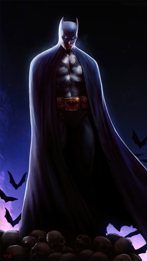 Batman standing on skulls with bats flying