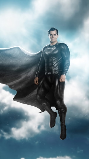 Superman in Black Suit Flying in Clouds
