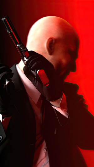 Agent 47 from Hitman holding a pistol