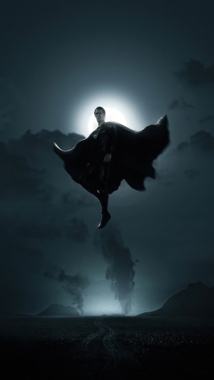 Superman flying in front of moon and clouds