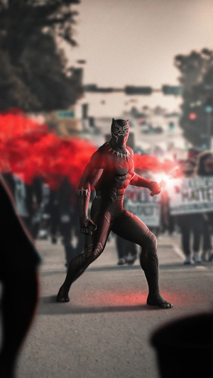Black Panther with red smoke in a protest