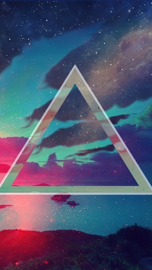 Abstract triangle over a colorful galaxy and landscape