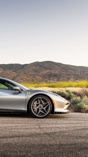 Silver Ferrari F8 Tributo parked on a road