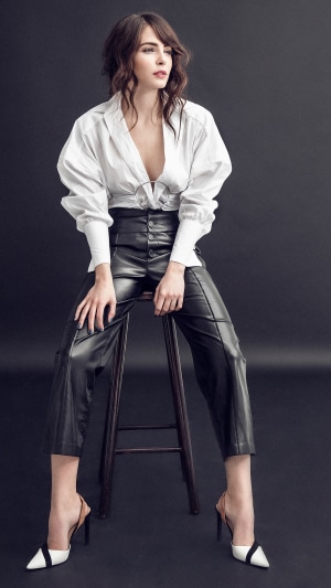 Andrea Duro sitting on a stool