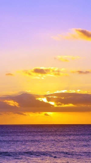 Ocean sunset with clouds and purple water 4K