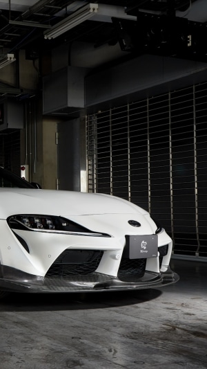 White Toyota Supra with custom front splitter