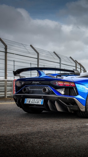 Blue Lamborghini Aventador SVJ on a Racetrack