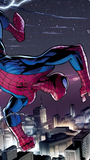 Spider-Man swinging over a city at night