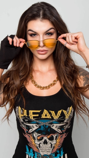Barbara Labres wearing a heavy metal t-shirt and sunglasses