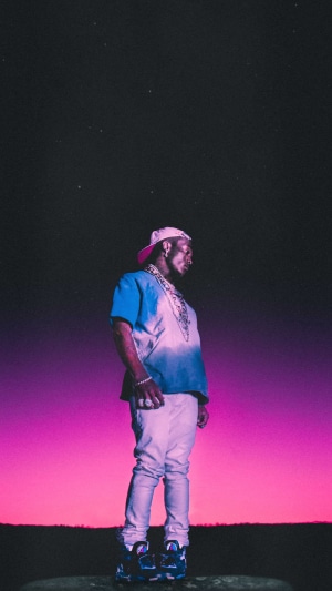 Lil Uzi Vert standing under a starry sky with pink and purple gradient