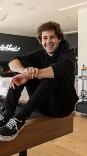 David Dobrik sitting on a table