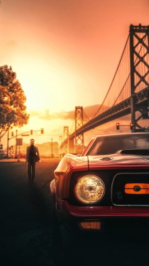 John Wick walking near a red car with a bridge in the background