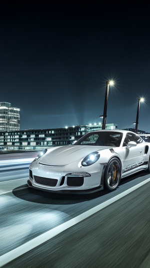 White Porsche 911 GT3 RS driving at night