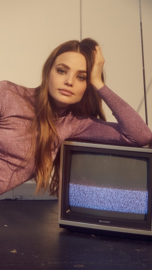 Kristine Froseth with a vintage television