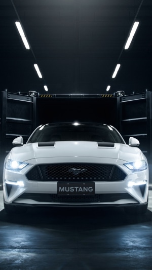 White Ford Mustang in a Garage