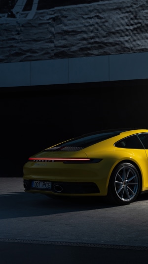Yellow Porsche 992 rear view 4K