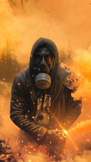 Person in gas mask with smoke bomb