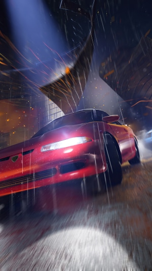 Red sports car driving in rain