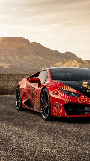 Red Lamborghini Huracan with gold pattern