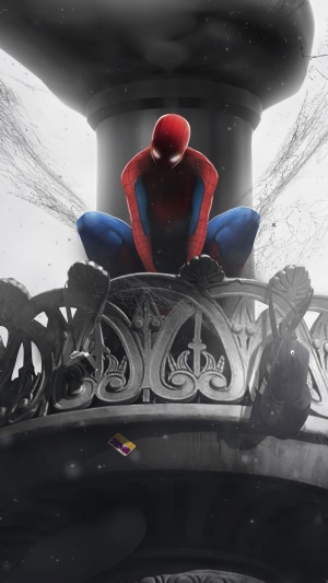 Spider-Man sitting on a decorative structure