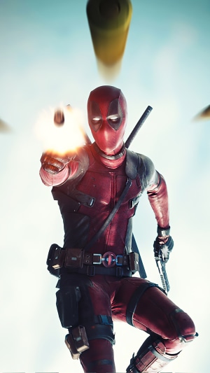 Deadpool shooting a gun with bullets in the air