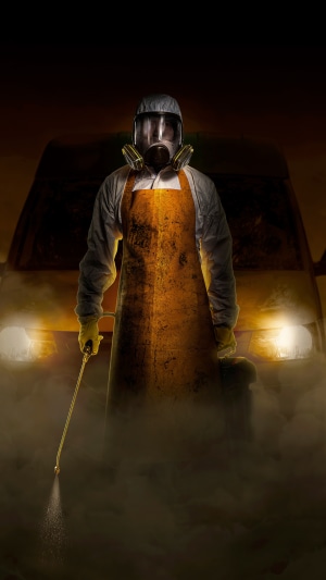 Man in Hazmat suit with gas mask and apron