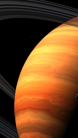 Saturn and its rings in space