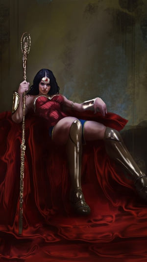 Wonder Woman sitting with a golden staff