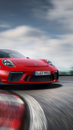 Red Porsche GT 9912 on a race track