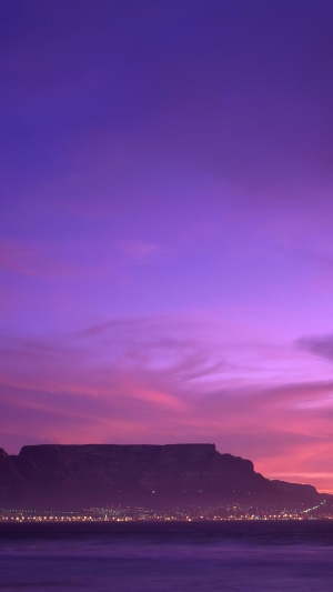 Table Mountain at sunset with city lights