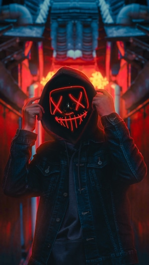 Person wearing a red LED mask and hoodie