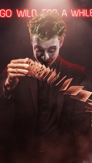 Joker throwing cards